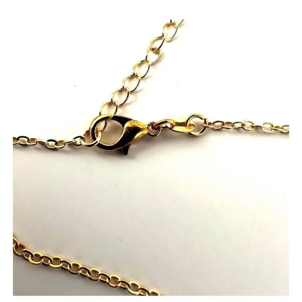 Gold tone heart with faux pearl bird pendant necklace